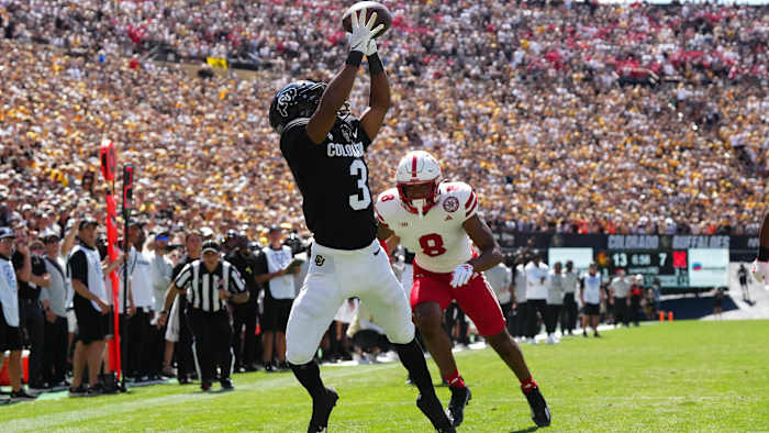 Colorado Buffaloes running back Dylan Edwards (3) reaches for the ball past Nebraska Cornhuskers cornerback.